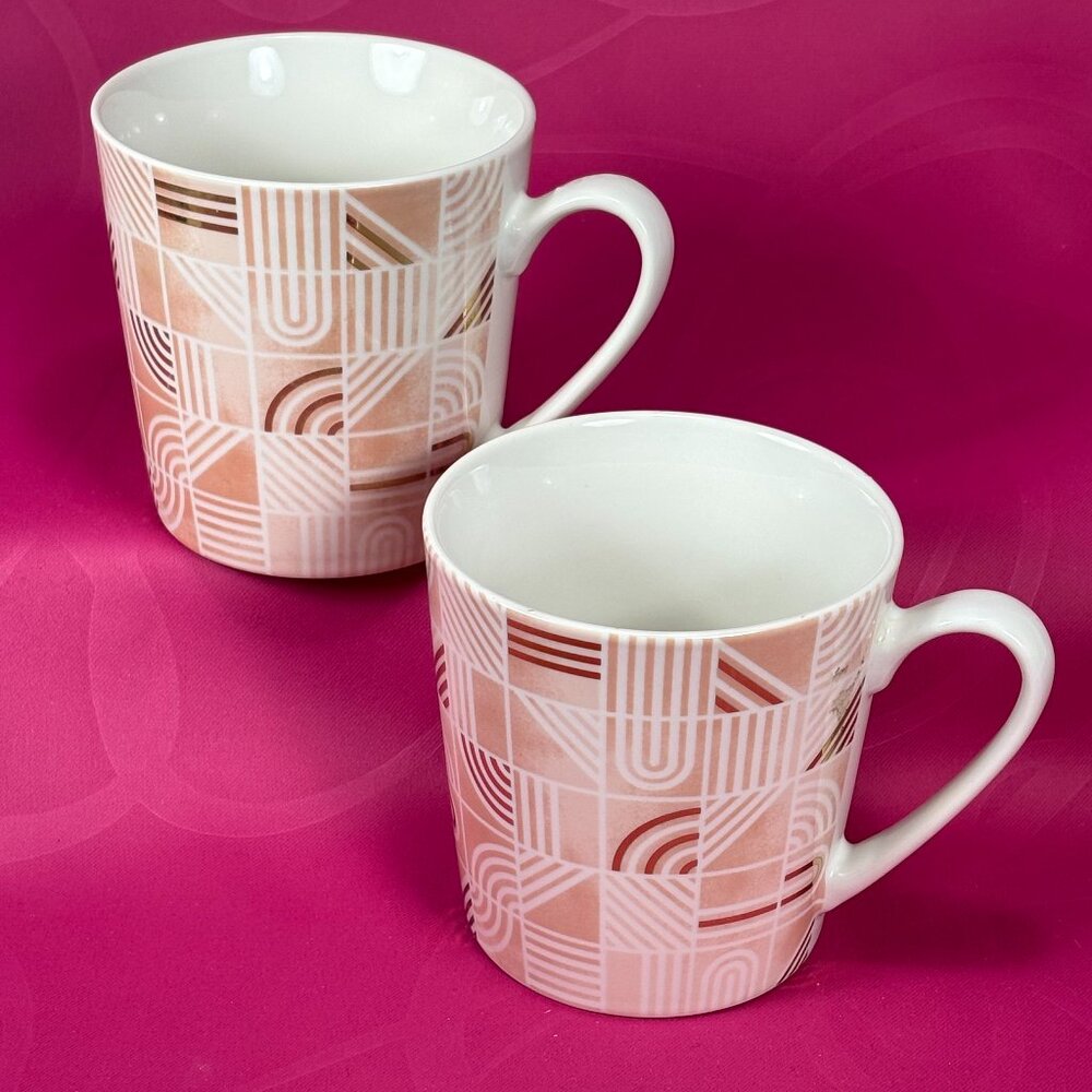pair of Life at Home colorful coffee mugs